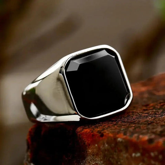 Black Gemstone Ring on a brick stone