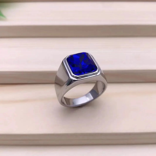 Modern Gemstone Ring with a blue gemstone on a wooden background