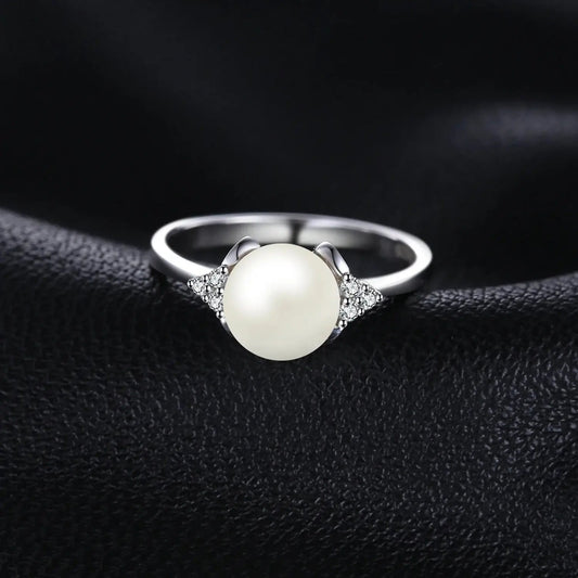 Silver and Pearl Ring on a leather background
